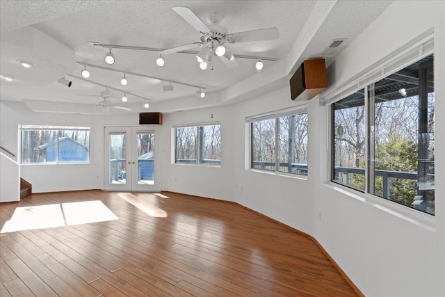 unfurnished sunroom featuring french doors and visible vents