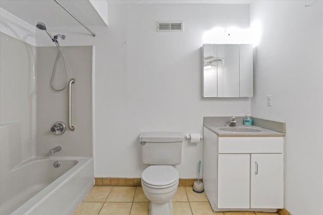 bathroom featuring toilet, vanity, visible vents, tile patterned flooring, and baseboards