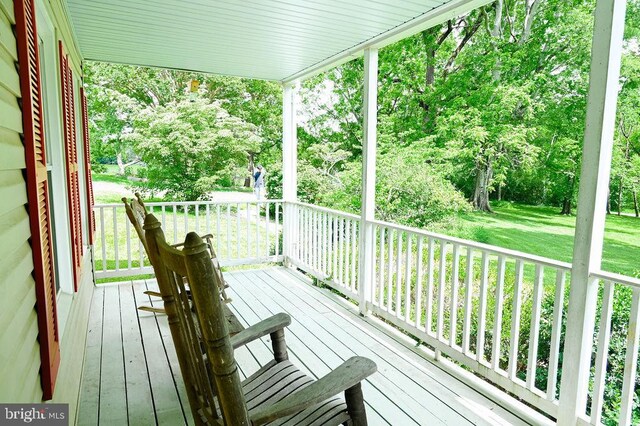 13498 Chesterfield Ln, Culpeper, VA 22701 - wooden porch featuring a yard