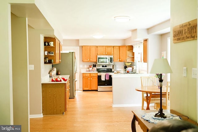 13498 Chesterfield Ln, Culpeper, VA 22701 - kitchen with stainless steel appliances, open shelves, light wood finished floors, and light countertops
