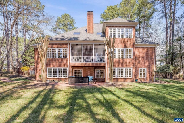 1880 Graham Ct, Keswick, VA 22947 - rear view of property with a patio, a sunroom, a chimney, a lawn, and brick siding