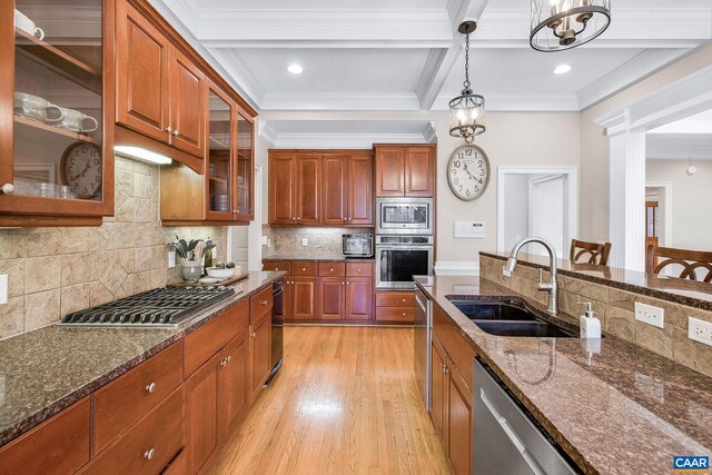 1880 Graham Ct, Keswick, VA 22947 - kitchen with decorative light fixtures, a sink, stainless steel appliances, dark stone counters, and light wood-type flooring