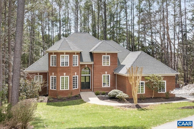 1880 Graham Ct, Keswick, VA 22947 - view of front of house featuring roof with shingles, brick siding, and a front lawn