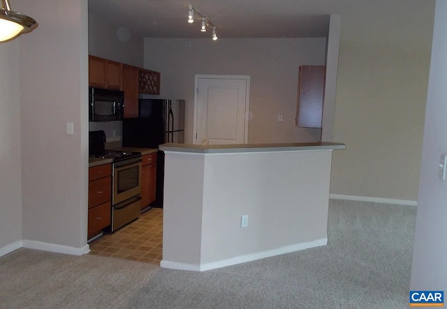 kitchen featuring stainless steel range with electric cooktop, black microwave, light carpet, and baseboards