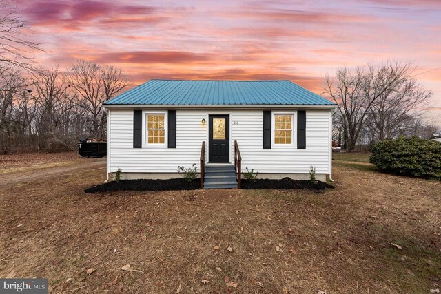 view of front of home with a yard