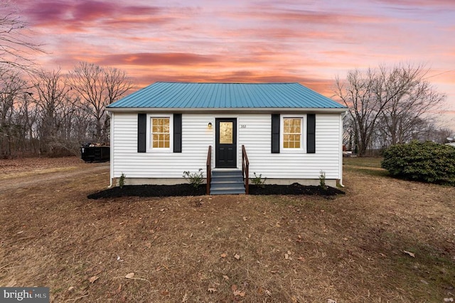 view of front of home with a yard