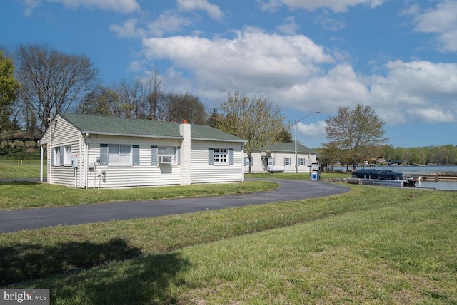 228 Poplar Dr, Louisa, VA 23093 - view of front of property with a front lawn, a chimney, and a shingled roof