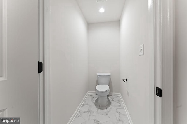 228 Poplar Dr, Louisa, VA 23093 - bathroom with marble look tile flooring, toilet, recessed lighting, and baseboards