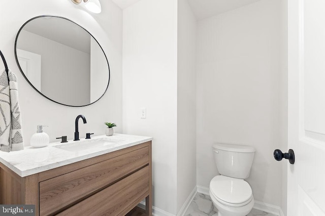 228 Poplar Dr, Louisa, VA 23093 - bathroom featuring vanity, baseboards, toilet, and marble finish floors