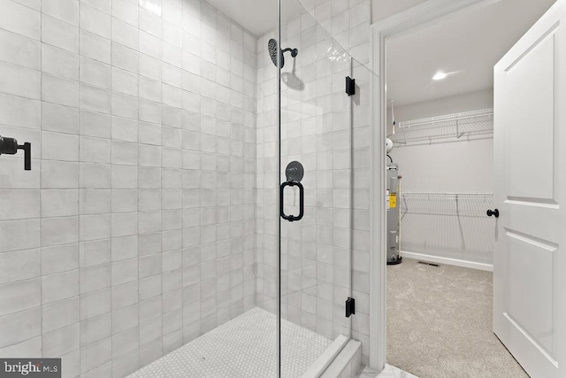 228 Poplar Dr, Louisa, VA 23093 - full bathroom featuring water heater, a stall shower, a walk in closet, and recessed lighting