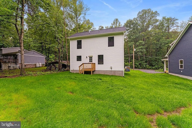 228 Poplar Dr, Louisa, VA 23093 - back of house with a yard and central AC unit