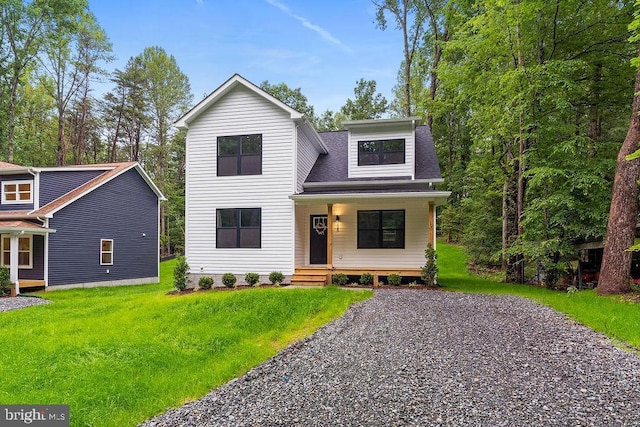 228 Poplar Dr, Louisa, VA 23093 - view of front of house featuring a front lawn, roof with shingles, and a porch