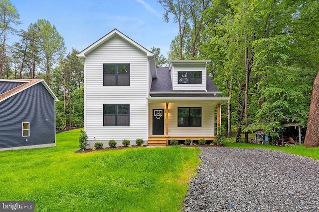 228 Poplar Dr, Louisa, VA 23093 - view of front of house with covered porch, a front yard, and a shingled roof