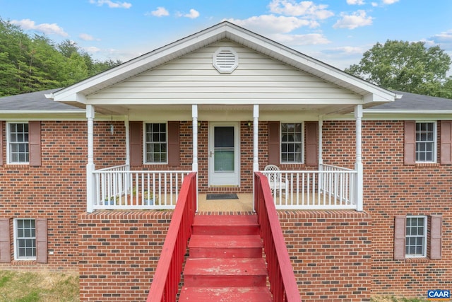 3590 Mountain Hill Rd, Palmyra, VA 22963 - single story home featuring a porch, brick siding, and stairway