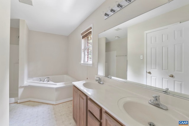 3590 Mountain Hill Rd, Palmyra, VA 22963 - full bath featuring double vanity, a garden tub, and tile patterned floors