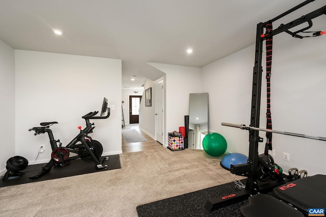 workout room featuring baseboards and recessed lighting