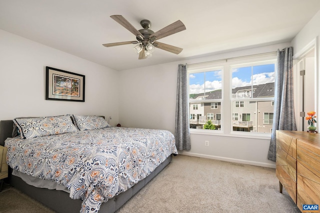 bedroom featuring carpet floors, baseboards, and ceiling fan