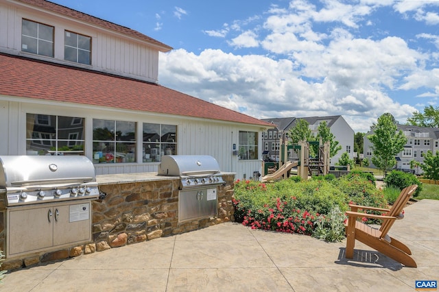 view of patio / terrace featuring exterior kitchen and grilling area