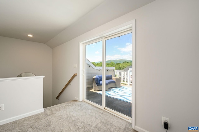 doorway with carpet floors and baseboards