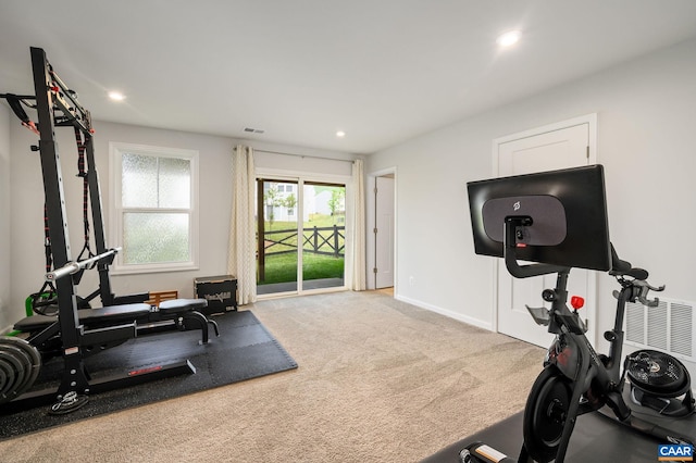 exercise area featuring recessed lighting, carpet flooring, and baseboards