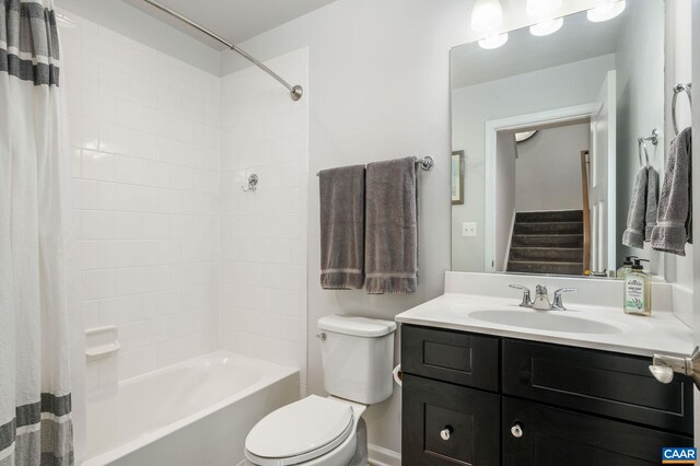 full bath featuring toilet, vanity, and shower / bathtub combination with curtain
