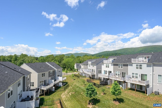 aerial view of residential area featuring a mountainous background