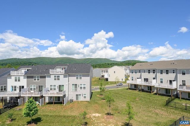 aerial view of residential area featuring a mountain backdrop