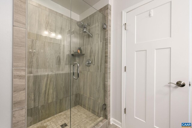 bathroom featuring a shower stall