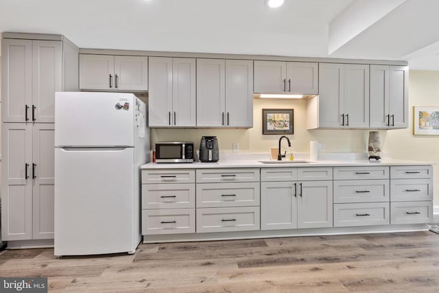 1875 Oneals Rd, Madison, VA 22727 - kitchen with freestanding refrigerator, a sink, stainless steel microwave, light countertops, and recessed lighting