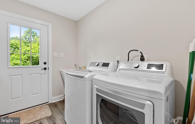 1875 Oneals Rd, Madison, VA 22727 - washroom featuring separate washer and dryer, wood finished floors, and baseboards