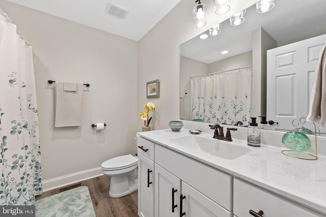 1875 Oneals Rd, Madison, VA 22727 - full bath featuring wood finished floors, vanity, toilet, baseboards, and a shower with shower curtain