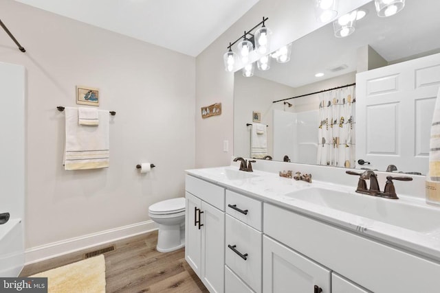 1875 Oneals Rd, Madison, VA 22727 - full bath featuring toilet, a shower with curtain, wood finished floors, double vanity, and baseboards