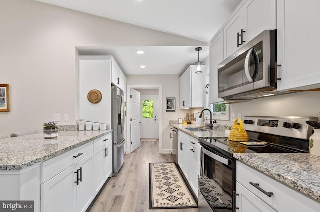 1875 Oneals Rd, Madison, VA 22727 - kitchen with stainless steel appliances, a sink, lofted ceiling, white cabinets, and light wood-style floors