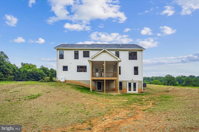 back of property featuring a yard, french doors, a sunroom, and cooling unit