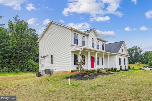 view of front of house featuring covered porch, a front yard, and central air condition unit