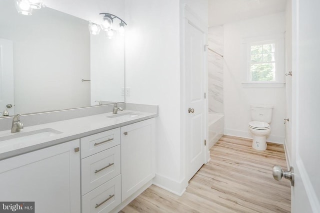 29 Dove Ct, Bumpass, VA 23024 - full bath featuring double vanity, wood finished floors, and washtub / shower combination