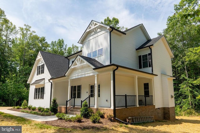 29 Dove Ct, Bumpass, VA 23024 - modern farmhouse featuring a porch and roof with shingles
