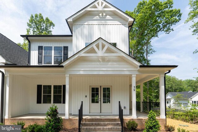 29 Dove Ct, Bumpass, VA 23024 - modern farmhouse featuring a porch
