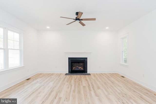 29 Dove Ct, Bumpass, VA 23024 - unfurnished living room with a fireplace with flush hearth, light wood-style flooring, ceiling fan, and recessed lighting