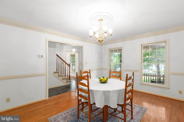411 Laurel Ave, Fredericksburg, VA 22408 - dining room with a chandelier, wood finished floors, stairway, and ornamental molding