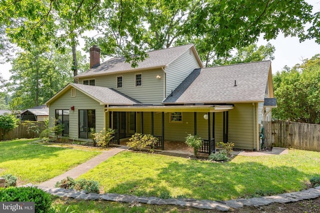 411 Laurel Ave, Fredericksburg, VA 22408 - back of house with a shingled roof, a chimney, and a sunroom
