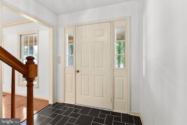 411 Laurel Ave, Fredericksburg, VA 22408 - foyer entrance with stairway and dark tile patterned floors