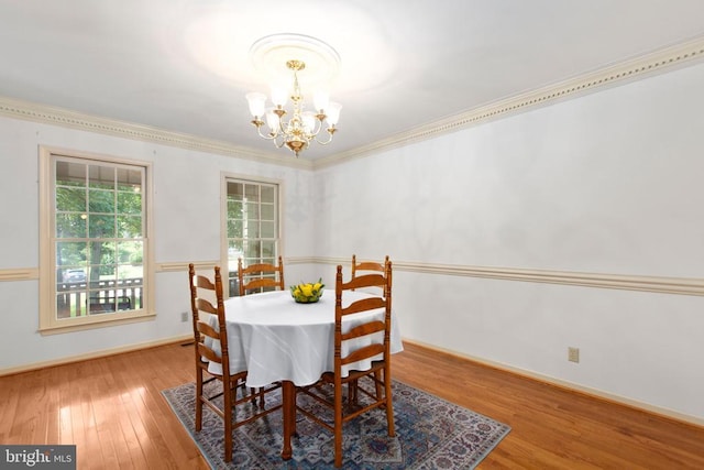 411 Laurel Ave, Fredericksburg, VA 22408 - dining space with a chandelier, wood finished floors, and ornamental molding