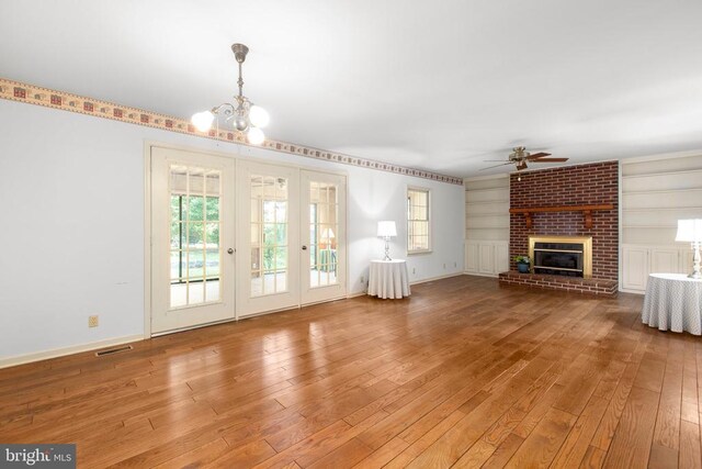 411 Laurel Ave, Fredericksburg, VA 22408 - unfurnished living room with ceiling fan, healthy amount of natural light, hardwood / wood-style flooring, and built in shelves