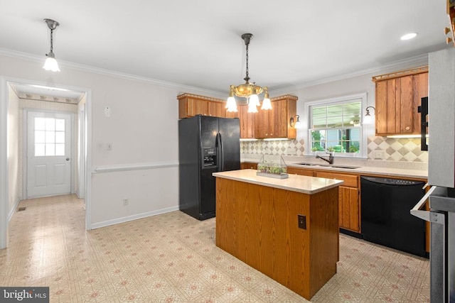 411 Laurel Ave, Fredericksburg, VA 22408 - kitchen featuring black appliances, light countertops, brown cabinets, decorative backsplash, and crown molding