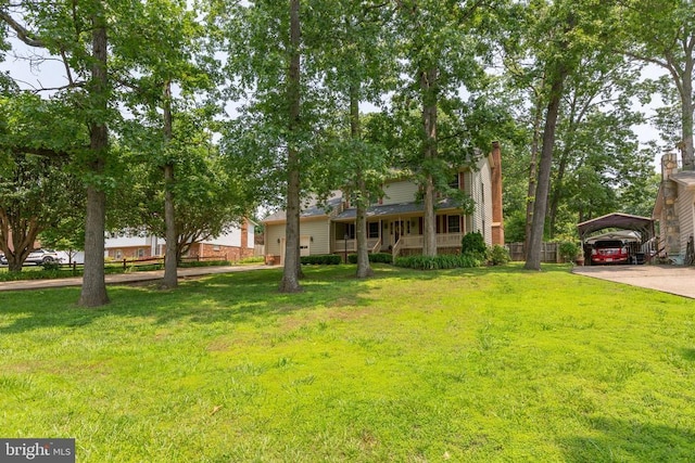 411 Laurel Ave, Fredericksburg, VA 22408 - view of front of home featuring a carport, a chimney, and a front lawn