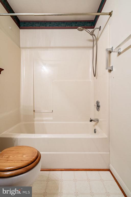 4117 Dartmoor Ct, Fredericksburg, VA 22408 - full bathroom with shower / bath combination, toilet, and baseboards