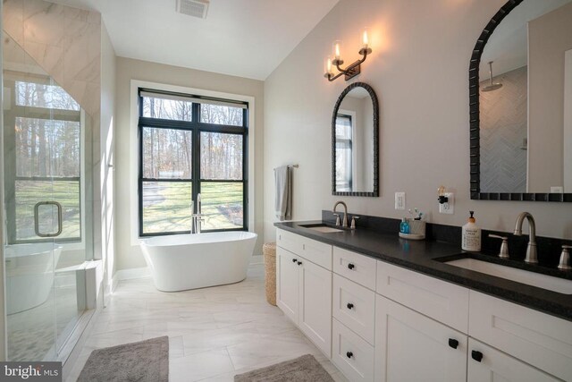 3 Carrs Bridge Rd, Lake Anna, Bumpass, VA 23024 - full bath featuring marble look tile flooring, a stall shower, double vanity, and a freestanding bath