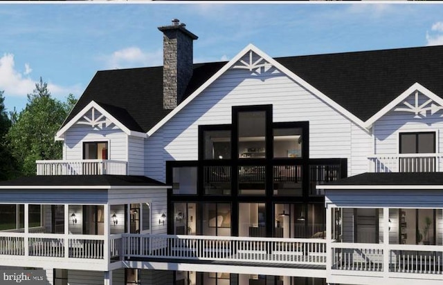 3 Carrs Bridge Rd, Lake Anna, Bumpass, VA 23024 - back of house with a chimney and a balcony