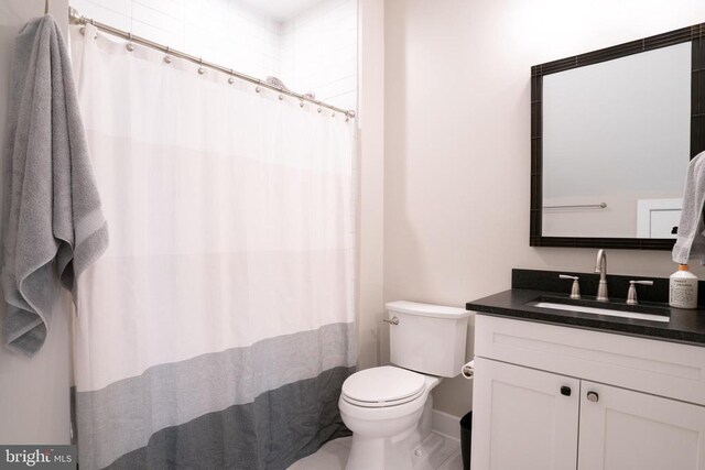 3 Carrs Bridge Rd, Lake Anna, Bumpass, VA 23024 - bathroom with toilet, vanity, baseboards, and curtained shower